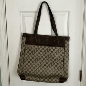 Authentic Gucci Tall Monogram Handbag. Comes with Authentification Certificate.